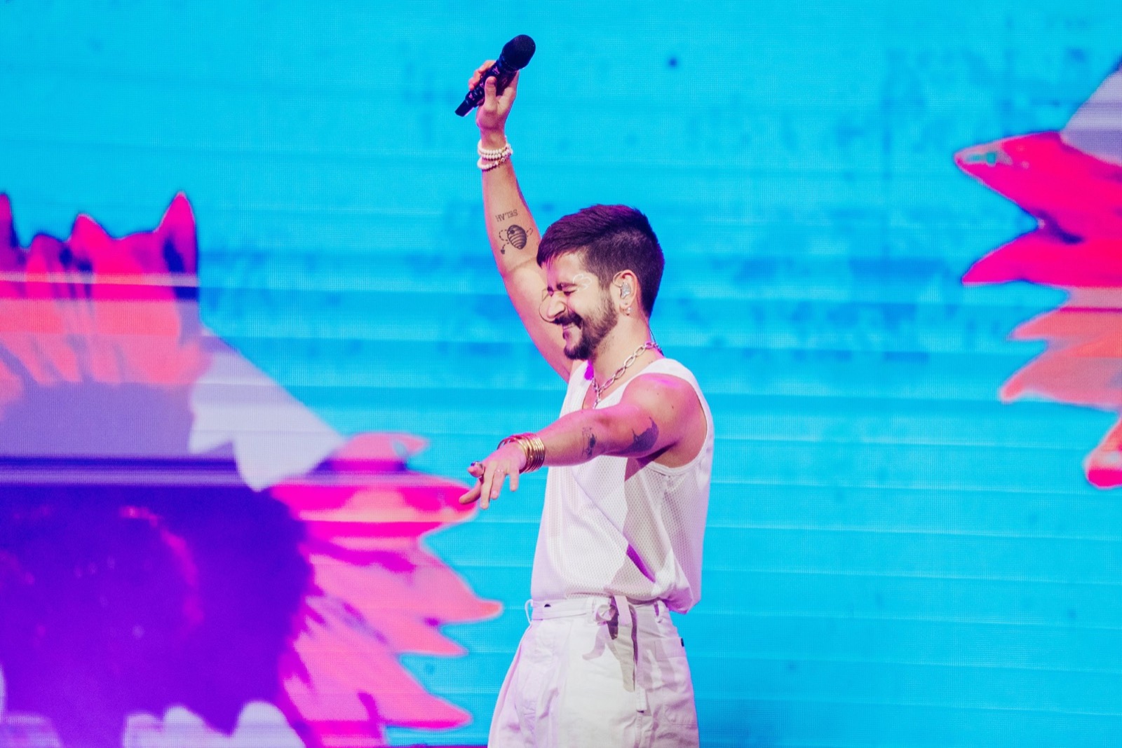 Camilo on stage in Orlando in front of a pink LED wall