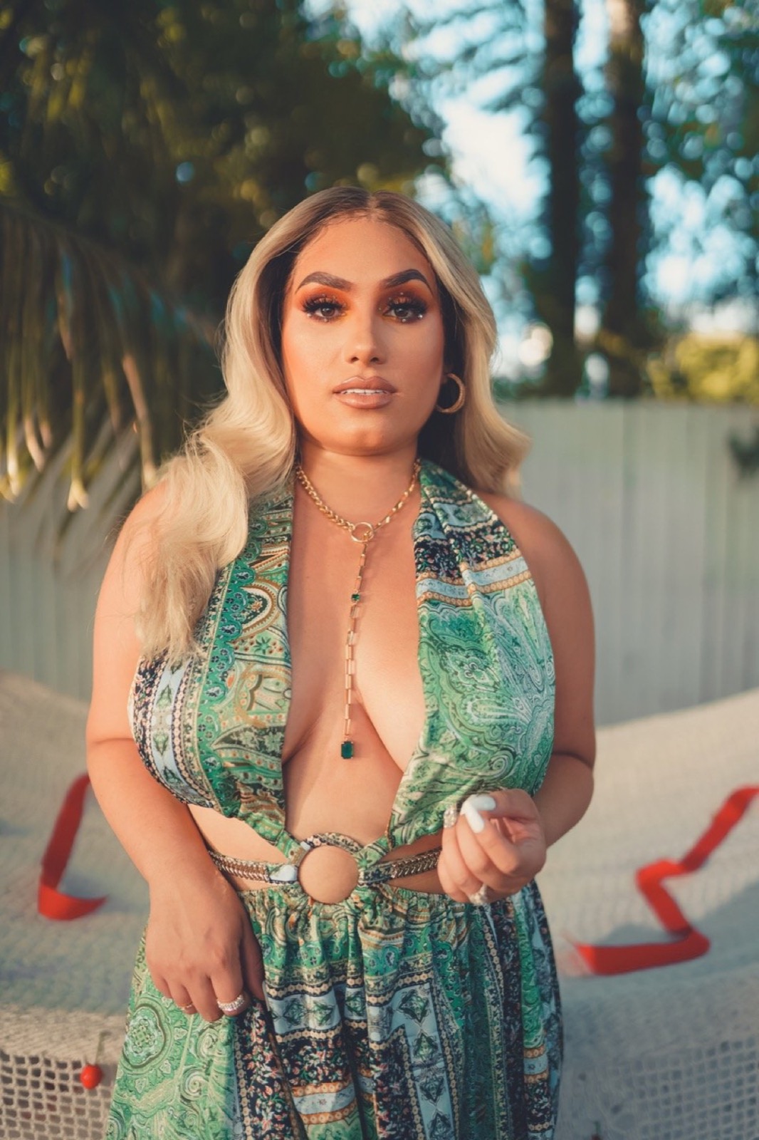 Music video still, green dress in the sun