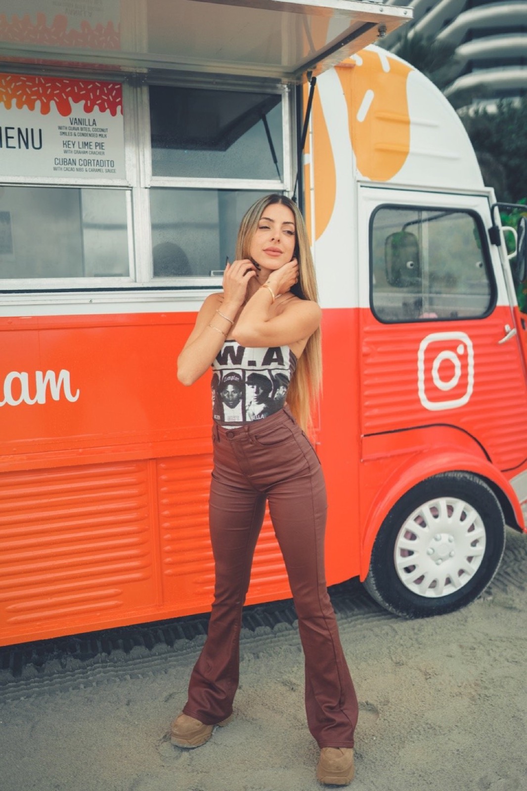 Guest in front of a red food truck at Billboard Latin Music Week