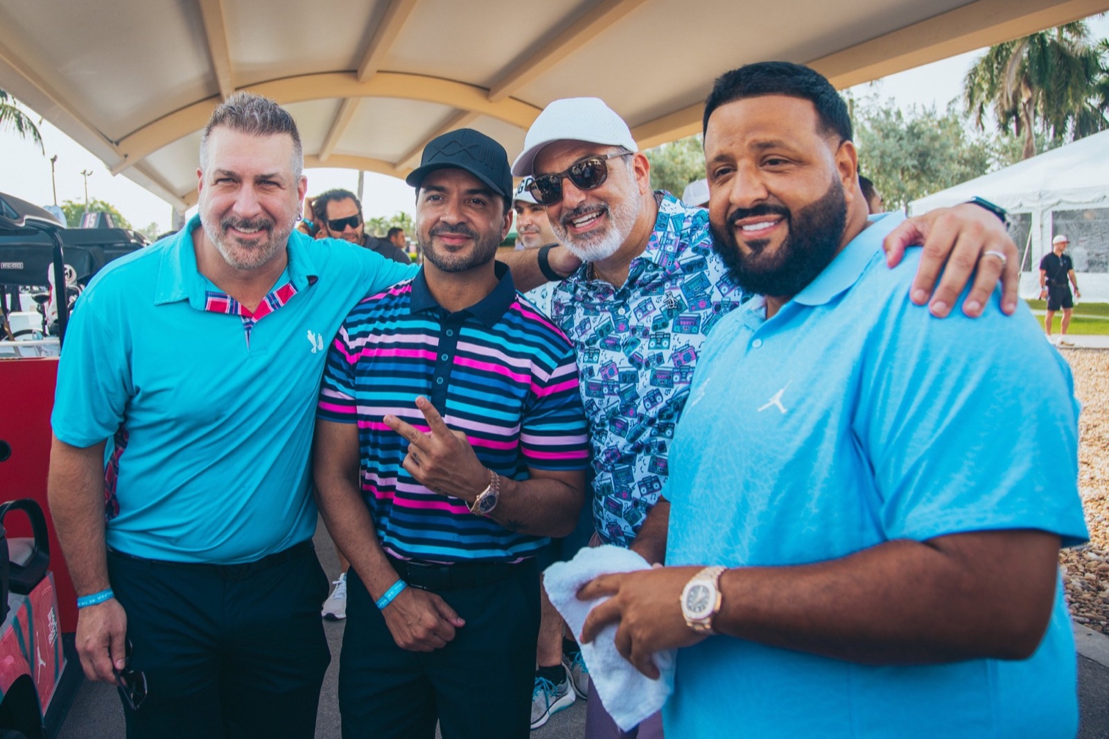 Four friends on the golf course at a charity tournament