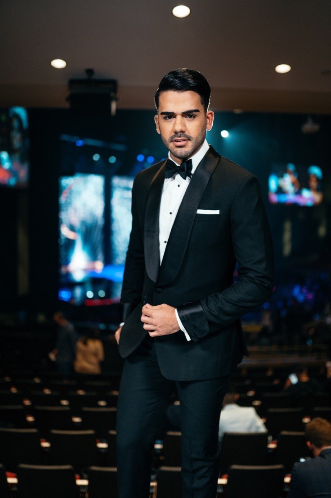 Host in a tuxedo at a televised event