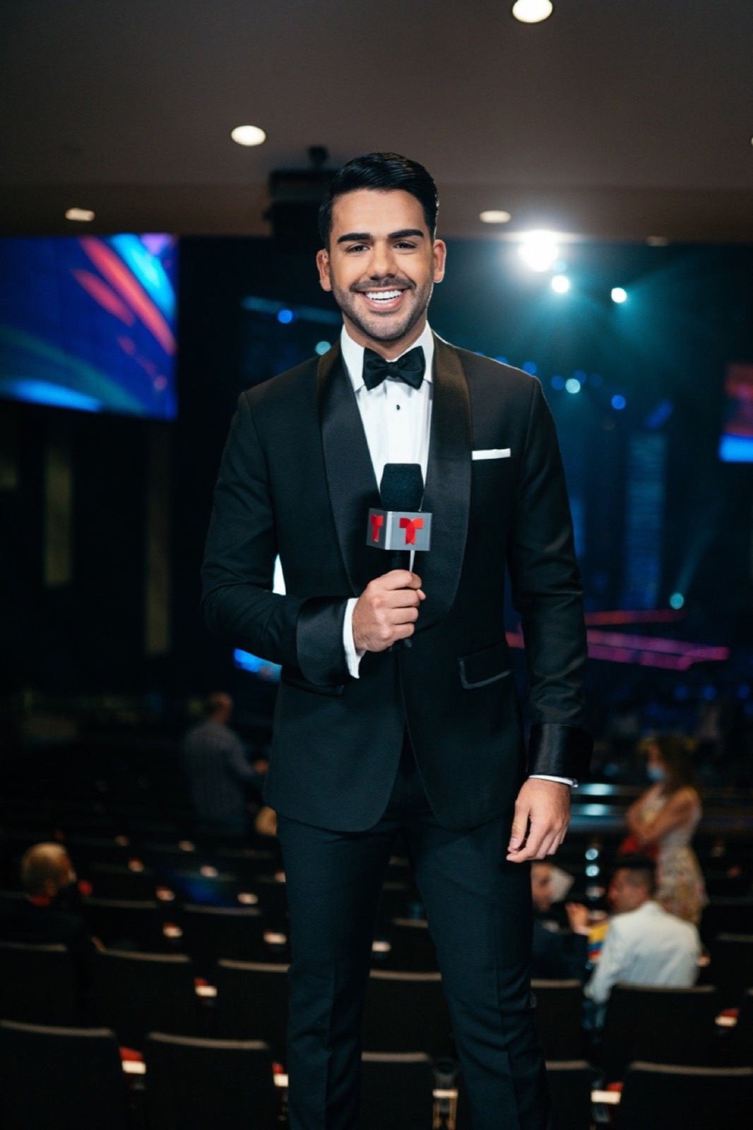 Host with a microphone on a gala stage