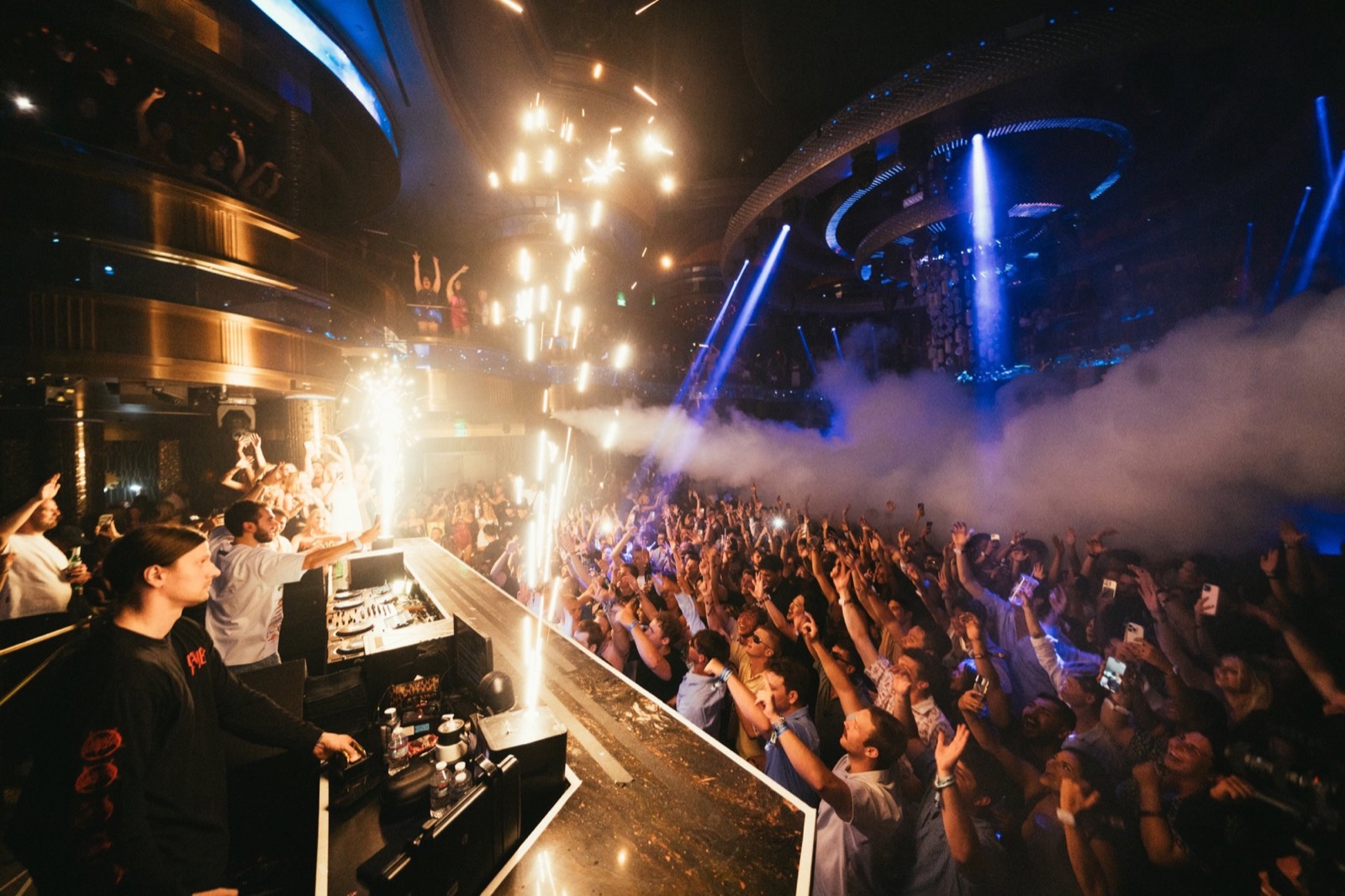 Sparklers going off over the crowd at a club show