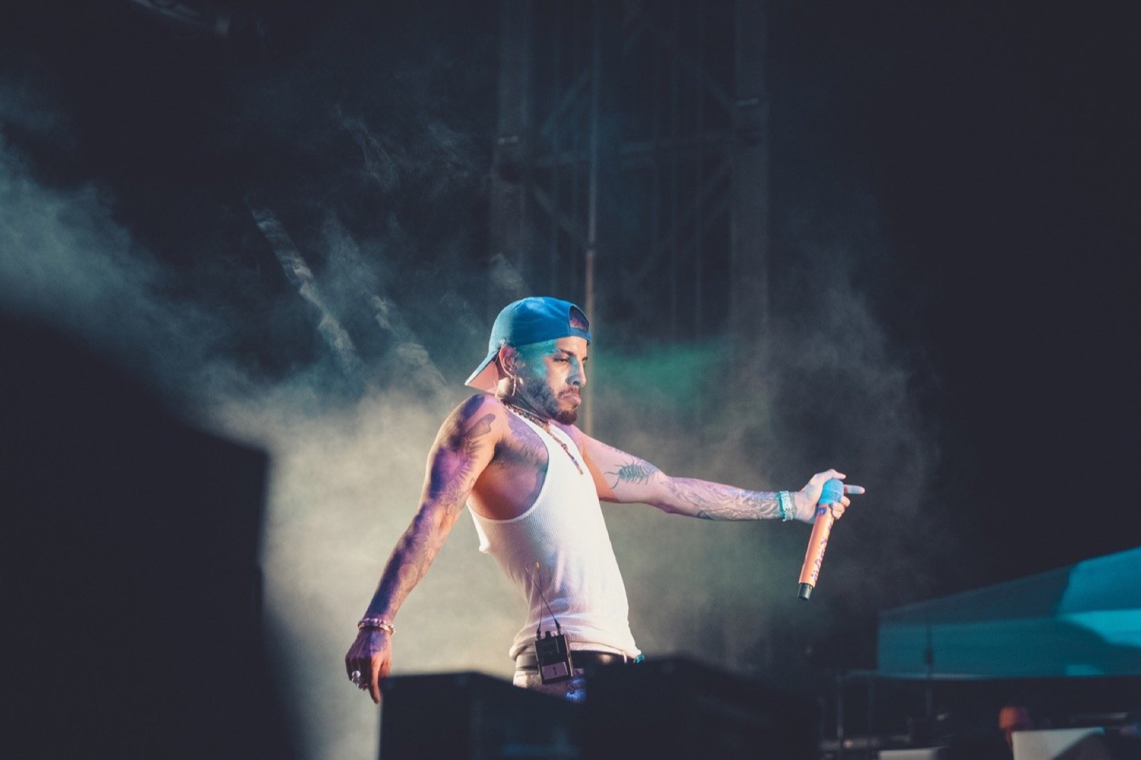 Artist pointing to the crowd through smoke